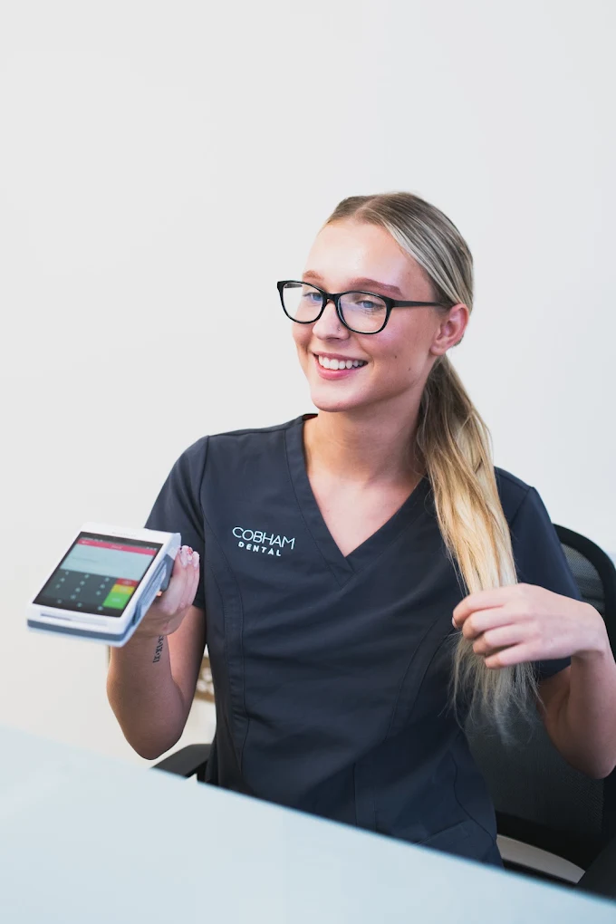 Cobham Dental team member available to discuss membership plans